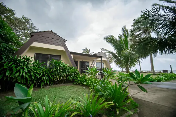 Beachfront villa surrounded by greenery and palm trees in South Goa